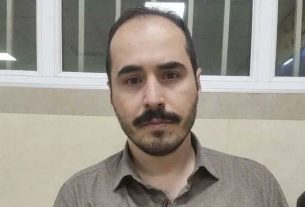 انتشار تصویر حسین رونقی در بیمارستان؛ هشتگ او ترند توییتر شد، قوه قضائیه می‌گوید به اوین برگشت
